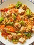 Pork & Freekeh Stir Fry with Brussels Sprouts, Carrots, and Shishito Peppers