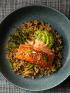 air fryer salmon with yum yum sauce on bed of rice, asparagus, and avocaco slices