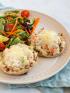 Tuna salad melt served with a salad on a plate