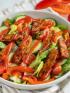 seared barbecue tempeh salad in white bowl