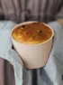 Person holding freshly baked cake