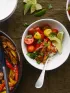 Chicken fajita bowl with cauliflower rice, cherry tomatoes, and avocado slices