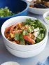 Chicken, black bean, red and green pepper bowl with cilantro, onion.