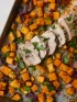 Sheet pan meal: sliced pork tenderloin, roasted sweet potatoes, and red onions.