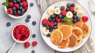 A plate of almond flour pancakes with berries