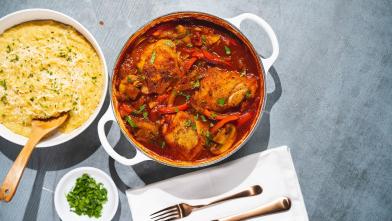 A bowl of several braised Moroccan chicken breasts