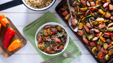 A sheet pan and bowl of a veggie-rich meal for a diabetic friendly diet