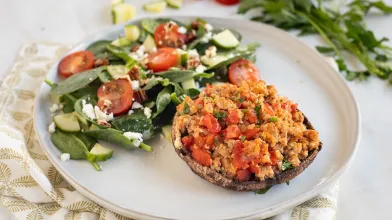 A plate with a very low carb keto meal of turkey stuffed mushroom and salad for diabetes friendly eating
