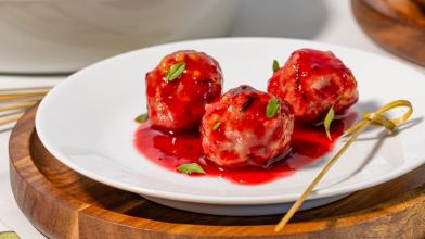 A plate with 3 turkey meatballs and cranberry sauce for diabetes friendly diet recipe