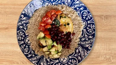 A bowl of vegetarian burrito ingredients