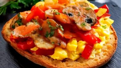 whole wheat breakfast pizza with eggs, mushrooms, and peppers