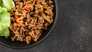 Cuban black beans and rice dish with lettuce.