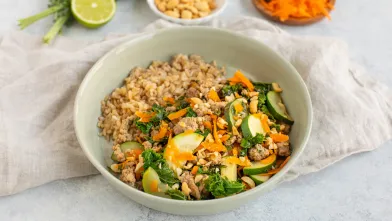 Turkey and vegetable stir-fry with brown rice in bowl