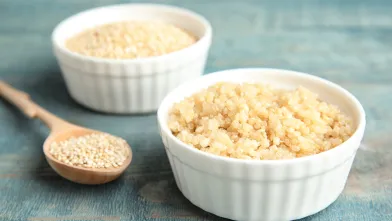 Cooked quinoa in small white bowl