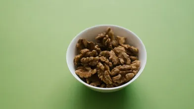 Small bowl with shelled walnuts