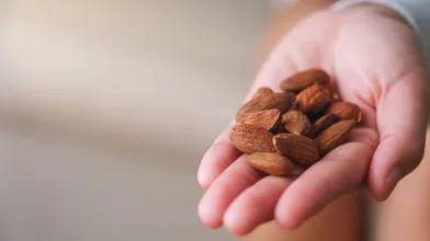 Open hand with a bunch of almonds