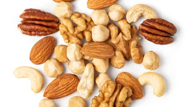 Group of mixed nuts including almonds, cashews, and walnuts