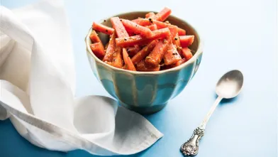 a bowl of roasted baby carrots