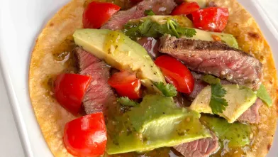 grilled steak tostada on a plate
