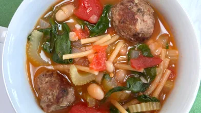 A bowl of meatball minestrone soup