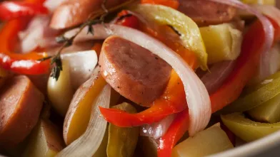 Sliced sausage, red &amp; white onions, bell peppers, potatoes, and thyme.