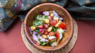 Peanut chaat in a wooden bowl.