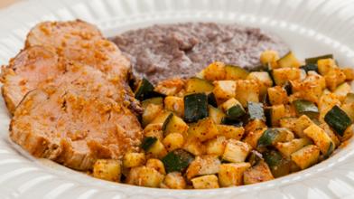 Mole Pork Tenderloin with Zucchini and Refried Black Beans