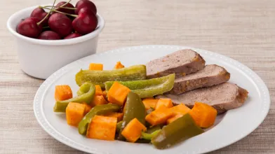 Spicy Apricot-Glazed Pork with Sweet Potatoes and Peppers