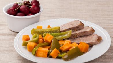Spicy Apricot-Glazed Pork with Sweet Potatoes and Peppers