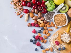 Scattered foods high in fiber like nuts, beans, and berries