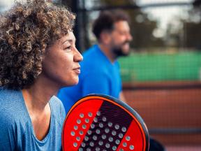 Man and woman playing pickleball