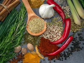 Overhead close-up of various spices and herbs