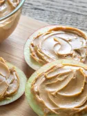 Apple slices with peanut butter spread on them