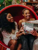 A group of women exchanging diabetes-friendly holiday gifts for food lovers