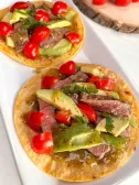grilled steak tostada on a plate