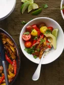 Chicken fajita bowl with cauliflower rice, cherry tomatoes, and avocado slices