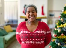 Senior African American woman in festive holiday sweater