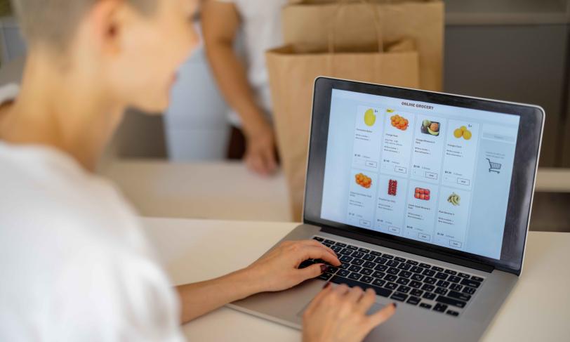 Woman doing online grocery shopping