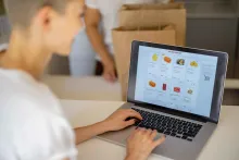 Woman doing online grocery shopping