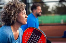 Man and woman playing pickleball