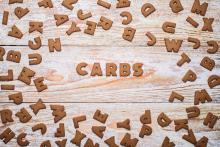 The word Carbs in wooden block letters