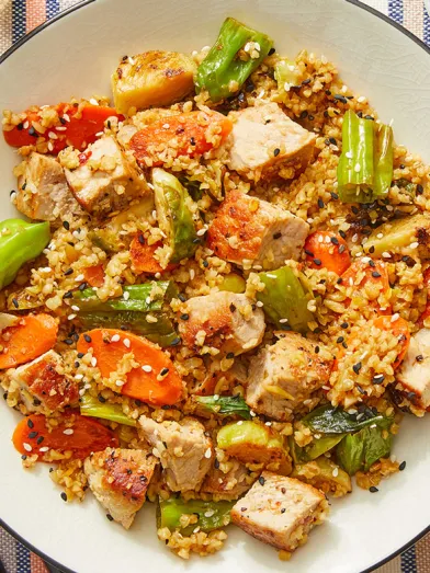Pork & Freekeh Stir Fry with Brussels Sprouts, Carrots, and Shishito Peppers
