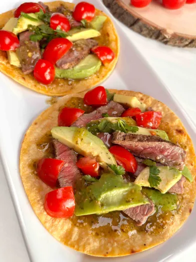 grilled steak tostada on a plate