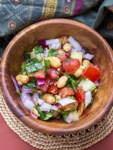 Peanut chaat in a wooden bowl.