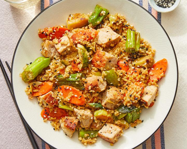 Pork & Freekeh Stir Fry with Brussels Sprouts, Carrots, and Shishito Peppers
