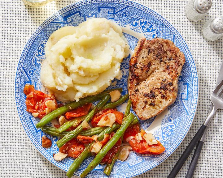 Tuscan-Spiced Pork & Mashed Potatoes with Green Beans and Roasted Tomato Dressing