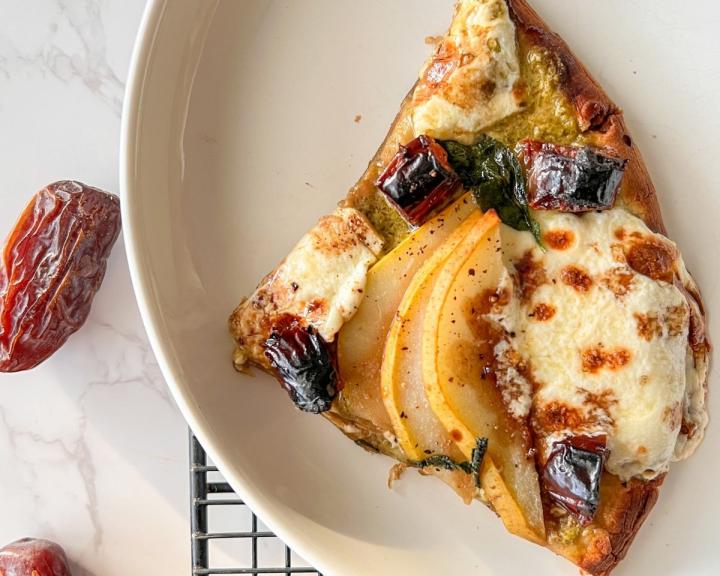 A slice of flatbread pizza with dates and pears for diabetic diet