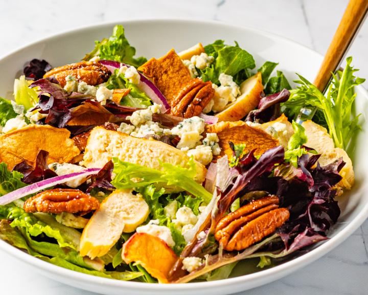 A colorful bowl of salad with homemade cider vinaigrette for a fall diabetes recipe
