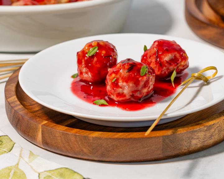A plate with 3 turkey meatballs and cranberry sauce for diabetes friendly diet recipe