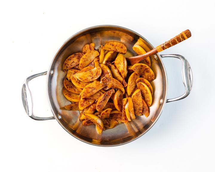 A pan filled with vegan cinnamon fried apples that are sweet but still diabetes friendly